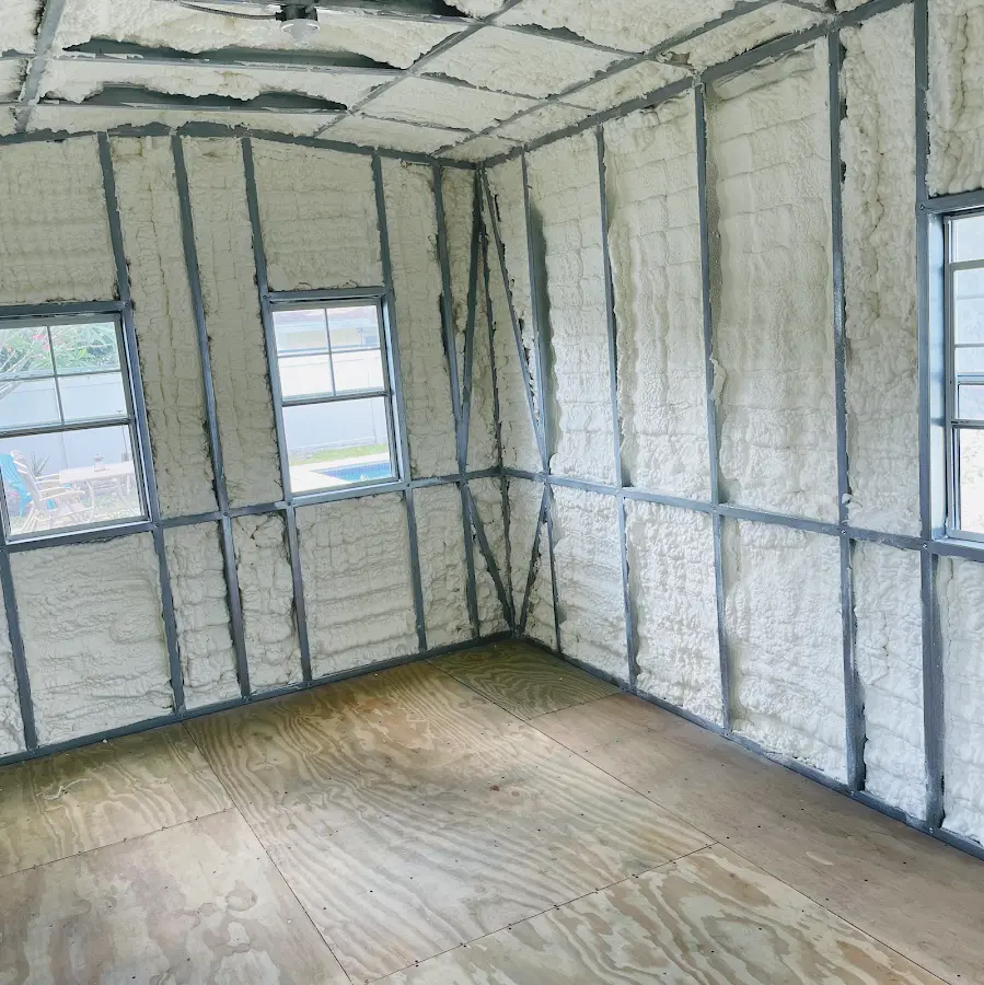 Closed-cell spray foam insulation applied to wall cavities in a residential project in Skowhegan